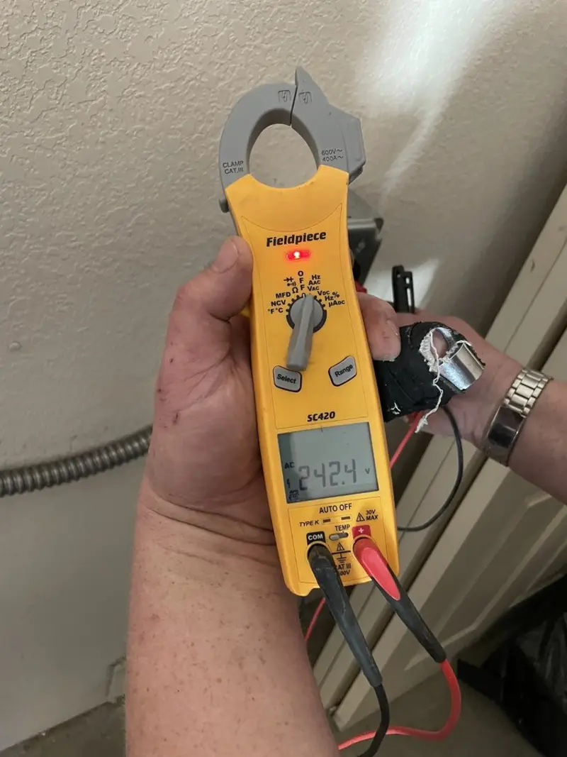 Voltage testing with clamp meter during Electrical Installation Services in Mexico